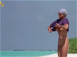 uber-sexy Bo Derek demonstrating off her fur covered cunny at the beach