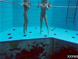 molten Russian gals swimming in the pool